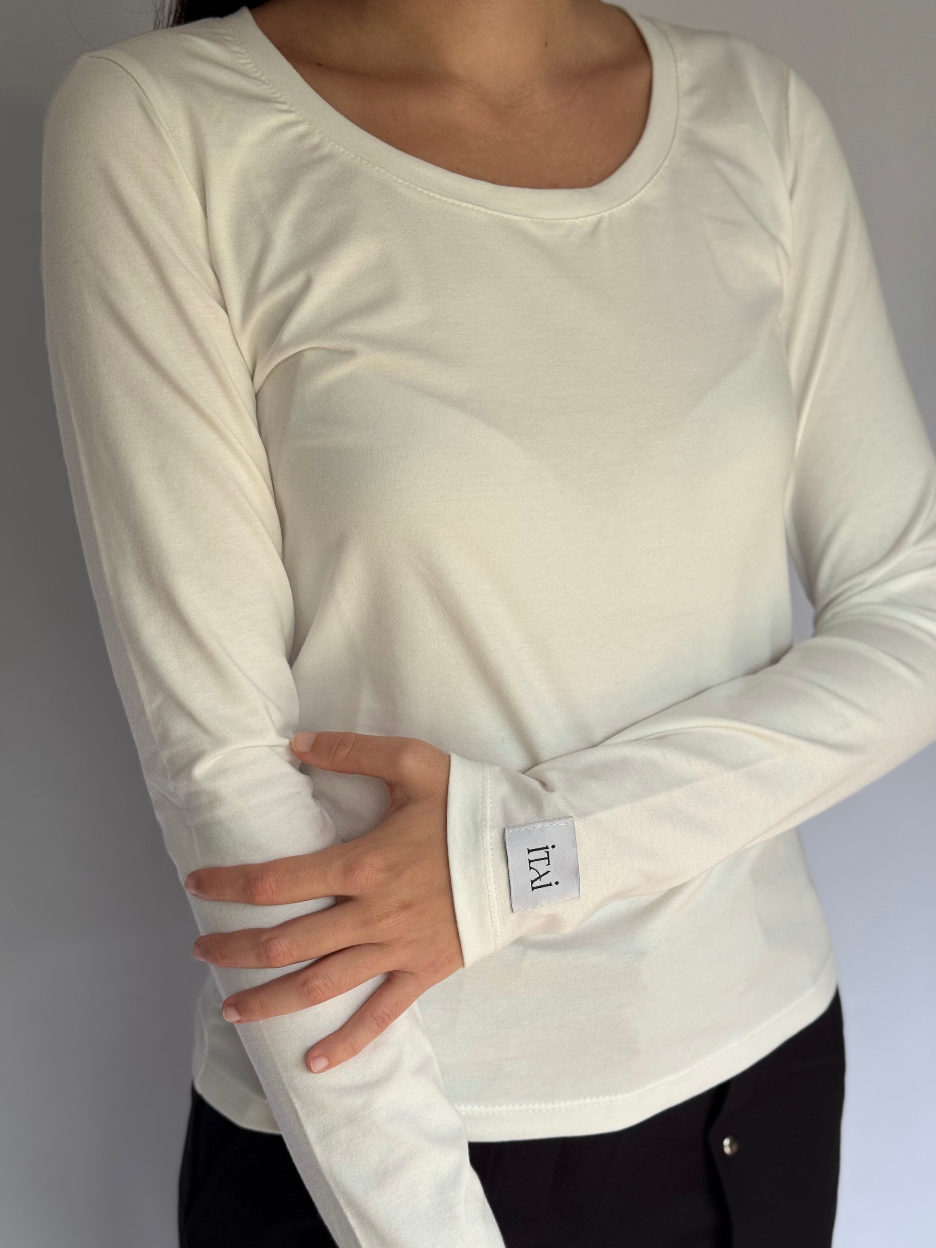 White long-sleeve shirt with ITAI brand label on a plain background