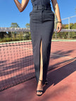Person wearing a navy blue bota skirt at the tennis court