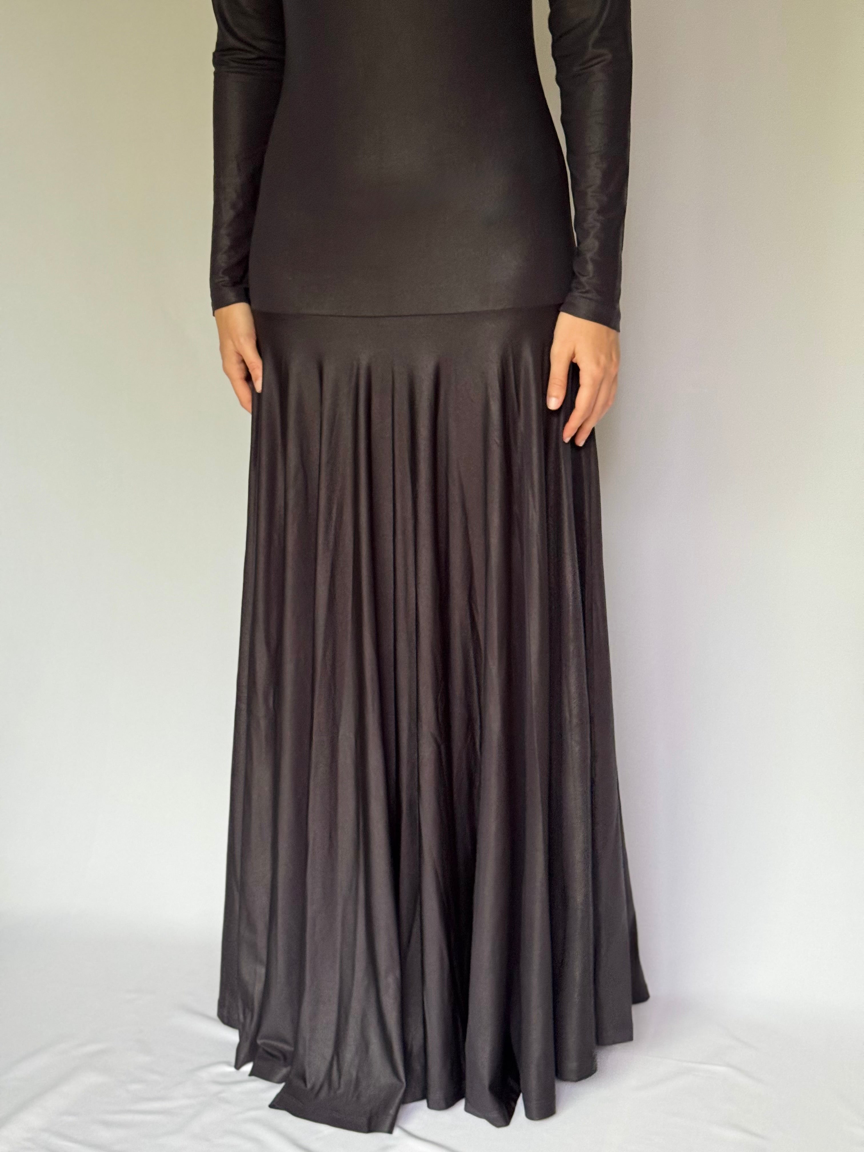 Long graphite gray dress with a pleated skirt on a white background